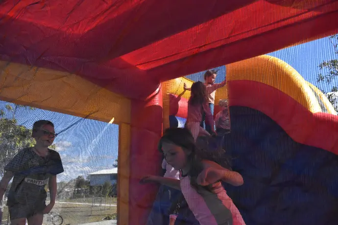 Children having fun on the Bounce n Slide jumping castle