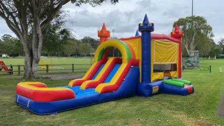 Themed bouncy house on park land Party hire at local council park land